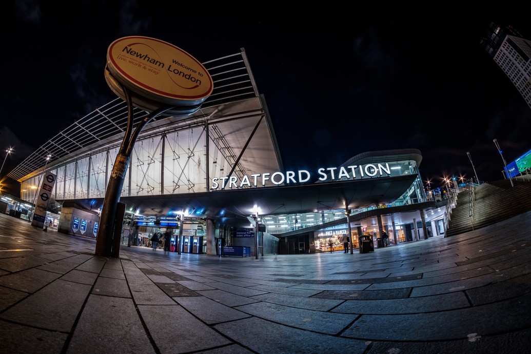 Outside Stratford station at night.