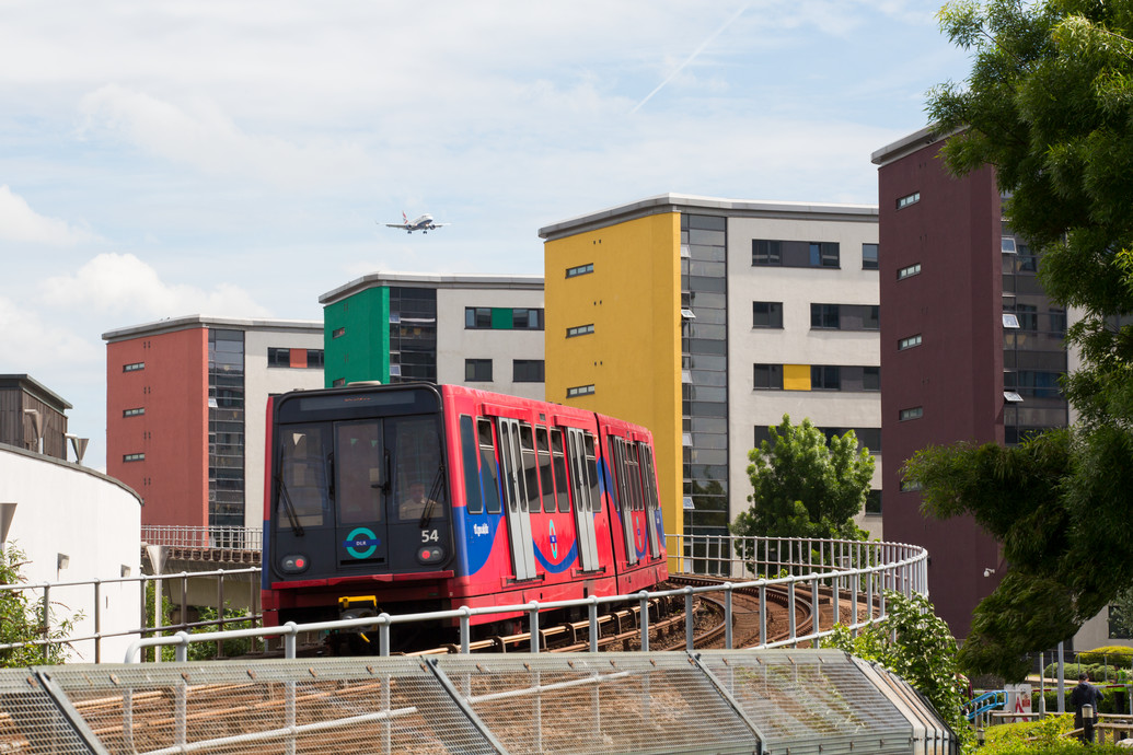 A Docklands light railway train on the tracks on campus