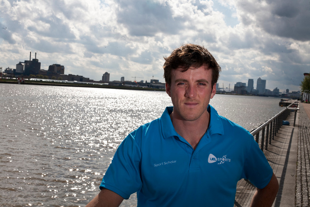 Rower Alan Sinclair standing in front of the River Thames.