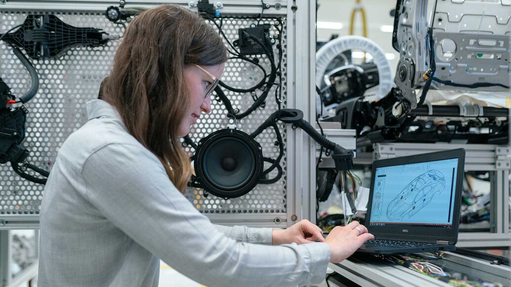 Woman working on a computer in an engineering lab