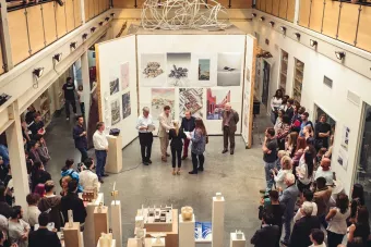 View of people at an exhibition inside a building